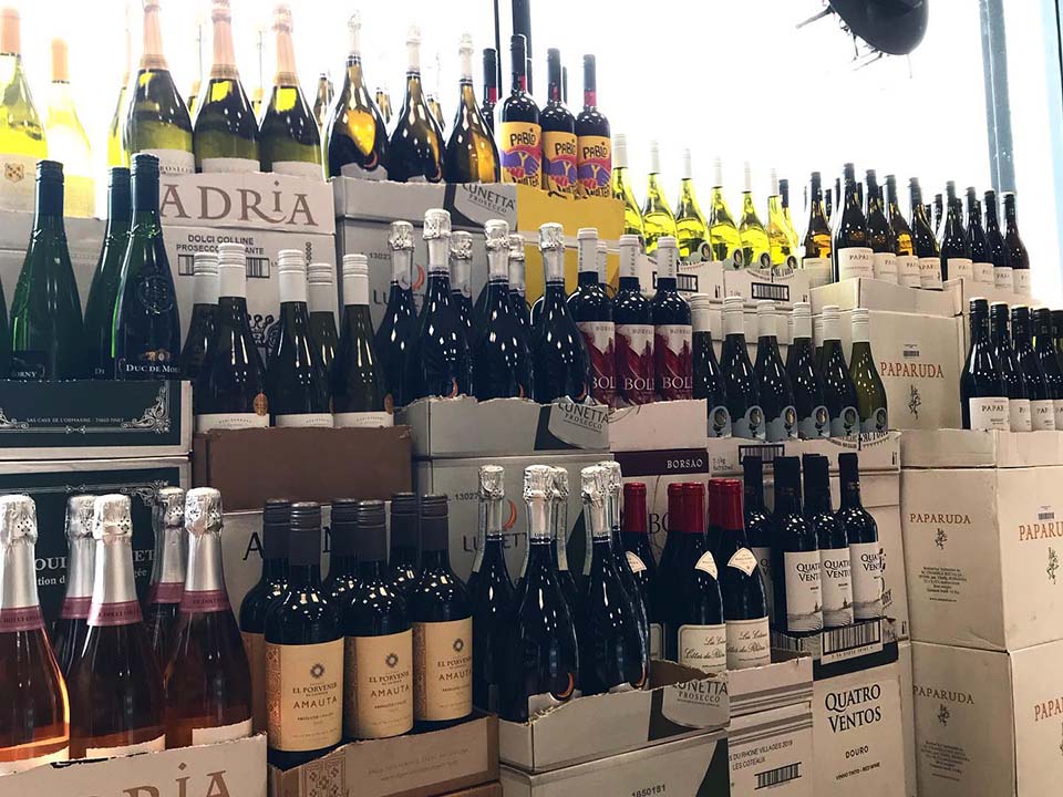 Inside shop with boxes of wine DC Wines